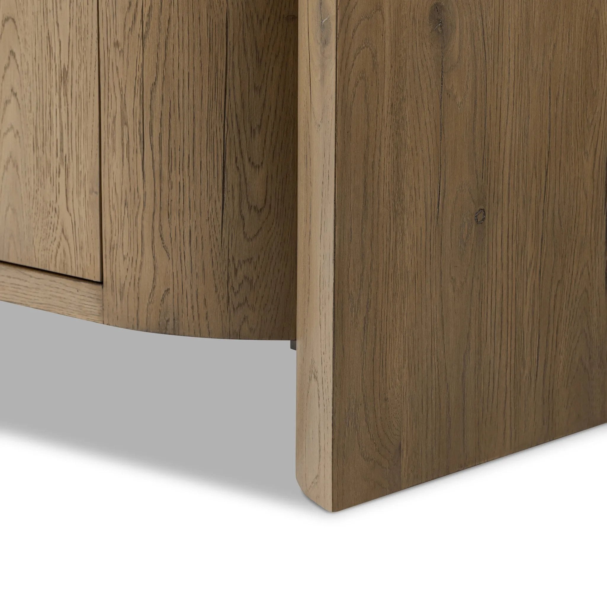 Featuring Cristopher Rubbed Light Oak Veneer Sideboard by Four Hands at Amethyst Home. A playful placement of rounded shapes and clean lines, this sideboard captivates with half-cylinder legs seamlessly blending into the storage case and top, complete with curved metal hardware. Finished in light oak for warm, light look that can move between styles with ease. Amethyst Home provides interior design, new home construction design consulting, vintage area rugs, and lighting in the Seattle metro area.