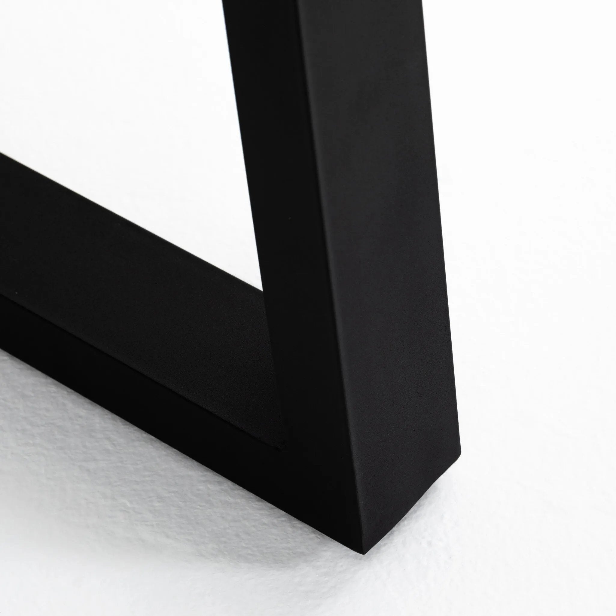 A strikingly simple poly-resin top derived from river sand is polished to a smooth sheen, while an angular black iron base adds architectural appeal to this outdoor-friendly dining table. Slight color variance is to be expected, and speaks to lava stone's organic nature. Cover or store indoors during inclement weather and when not in use. Amethyst Home provides interior design, new home construction design consulting, vintage area rugs, and lighting in the Alpharetta metro area.