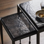Featuring Dexter Smoked Black Cast Glass Nesting Tables by Four Hands at Amethyst Home. Embrace the mysterious with the Dexter smoked glass nesting tables.  Beautiful smoked glass gives a warm modern vibe while being practical.Overall Dimensions: 16.25"w x 16.25"d x 21.00"hWeight : 52.91 lbsMaterials : Cast Glass, Iron. Amethyst Home provides interior design, new home construction design consulting, vintage area rugs, and lighting in the Omaha metro area.