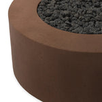 This outdoor fire table is a welcoming centerpiece designed for gathering. Made from glass-reinforced concrete, each piece is naturally finished with deep tones of pewter and dark grey. The monolithic shape is completed with lavastones in the center, bringing together a bold, monochromatic look. Amethyst Home provides interior design, new home construction design consulting, vintage area rugs, and lighting in the Alpharetta metro area.