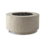 This outdoor fire table is a welcoming centerpiece designed for gathering. Made from glass-reinforced concrete, each piece is naturally finished with deep tones of pewter and dark grey. The monolithic shape is completed with lavastones in the center, bringing together a bold, monochromatic look. Amethyst Home provides interior design, new home construction design consulting, vintage area rugs, and lighting in the Nashville metro area.