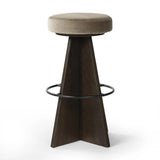 Featuring Damon Sapphire Khaki  Swivel Bar + Counter Stool by Four Hands at Amethyst Home. Large angular panels merge to form a geometrically inspired base in this modern counter stool. The circle metal ring around the base serves as a footrest, while the round upholstered cushion provides comfortable seating. The 360-degree swivel function adds versatility, a. Amethyst Home provides interior design, new home construction design consulting, vintage area rugs, and lighting in the Boston metro area.