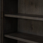 Featuring Dawes Smoked Black Oak Cabinet by Four Hands at Amethyst Home. Work the timeless charm of a vintage find into your collection. Smoked black oak cabinetry features softened mullions and rounded glass panels, with aged bronze barrel hinges and finial detailing. Generous storage and display options empower you to create a space that tells your story.Ove. Amethyst Home provides interior design, new home construction design consulting, vintage area rugs, and lighting in the Dallas metro area.