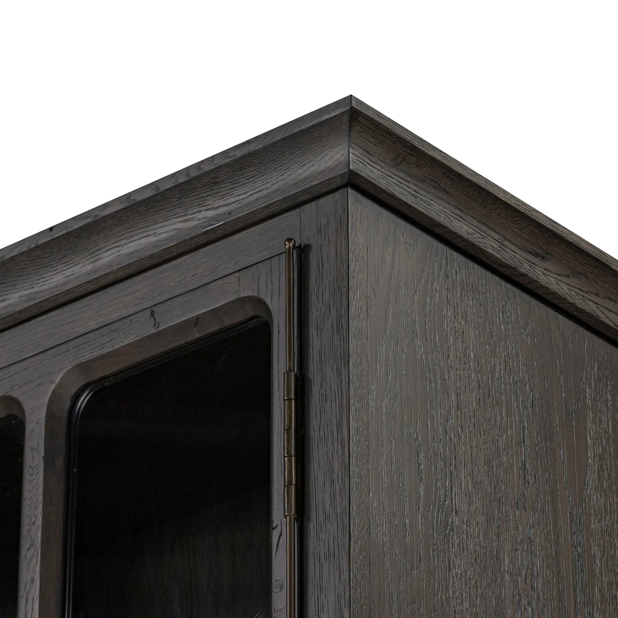 Featuring Dawes Smoked Black Oak Cabinet by Four Hands at Amethyst Home. Work the timeless charm of a vintage find into your collection. Smoked black oak cabinetry features softened mullions and rounded glass panels, with aged bronze barrel hinges and finial detailing. Generous storage and display options empower you to create a space that tells your story.Over. Amethyst Home provides interior design, new home construction design consulting, vintage area rugs, and lighting in the Omaha metro area.