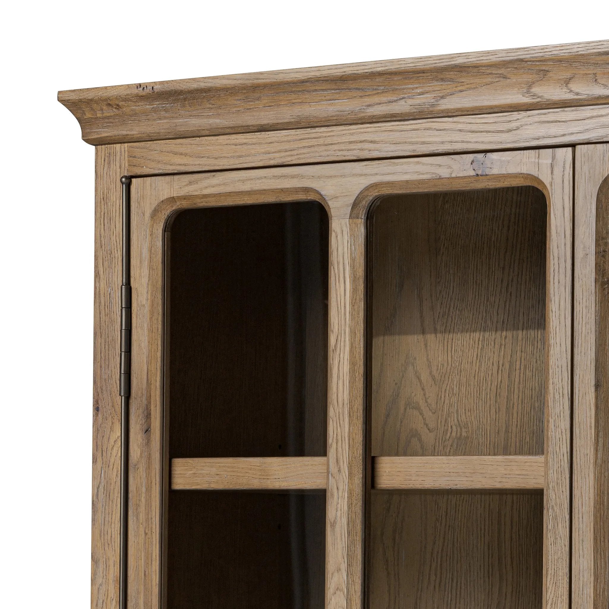 Featuring Dawes Weathered Oak Cabinet by Four Hands at Amethyst Home. Work the timeless charm of a vintage find into your collection. Weathered oak cabinetry features softened mullions and rounded glass panels, with aged bronze barrel hinges and finial detailing. Generous storage and display options  empower you to create a space that tells your story.Overa. Amethyst Home provides interior design, new home construction design consulting, vintage area rugs, and lighting in the San Diego metro area.
