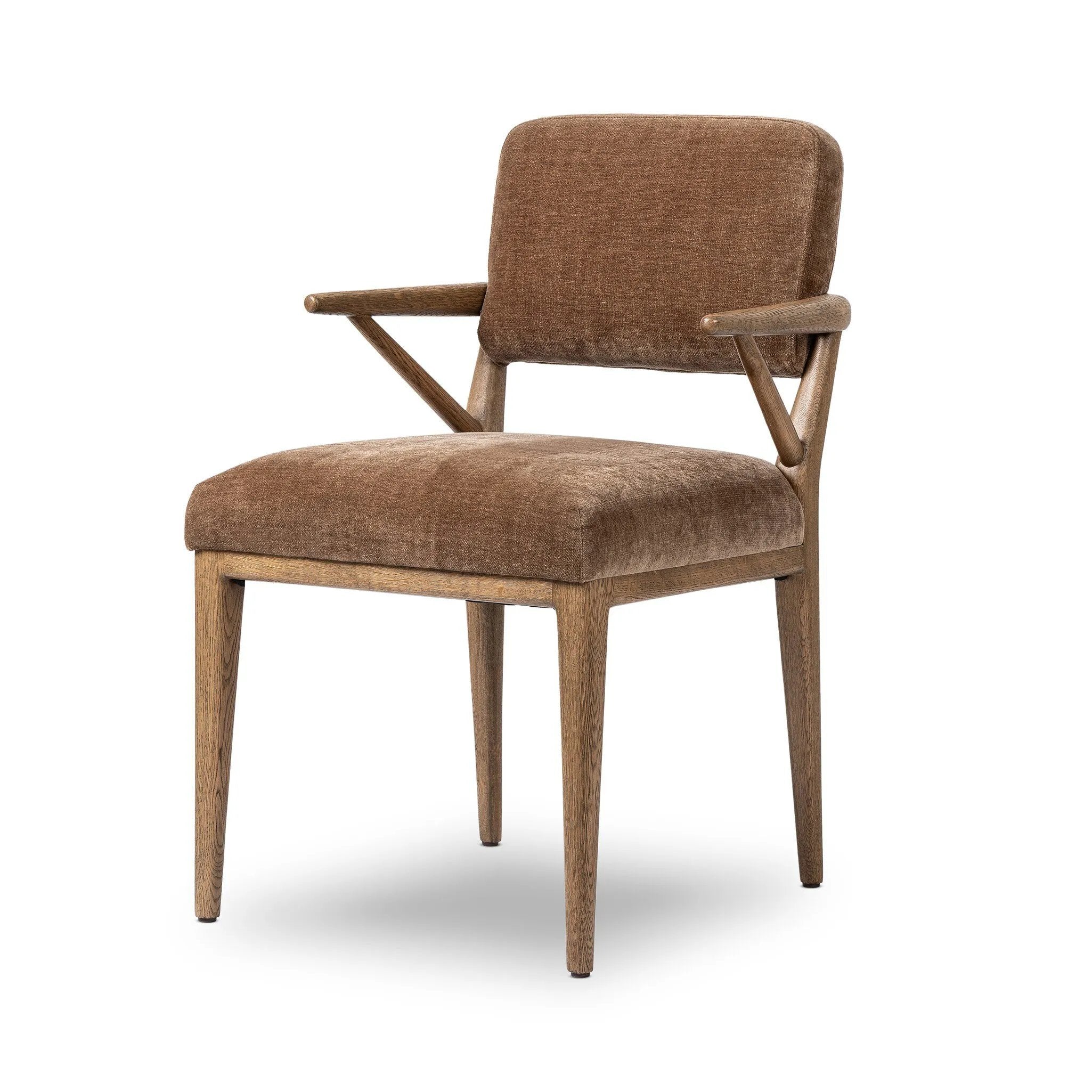 Pastoral inspiration defines a thoughtfully designed dining chair of toasted oak, while soft earthen upholstery covers a comfortable seat and back Amethyst Home provides interior design, new home construction design consulting, vintage area rugs, and lighting in the Portland metro area.