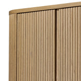 Crafted from light oak with a plinth-style base, rounded sides and linear reeding, this tall cabinet works subtle midcentury vibes into any space. Fully finished interior and shelves for quality detailing inside and out Amethyst Home provides interior design, new home construction design consulting, vintage area rugs, and lighting in the Charlotte metro area.