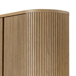 Crafted from light oak with a plinth-style base, rounded sides and linear reeding, this tall cabinet works subtle midcentury vibes into any space. Fully finished interior and shelves for quality detailing inside and out Amethyst Home provides interior design, new home construction design consulting, vintage area rugs, and lighting in the Park City metro area.