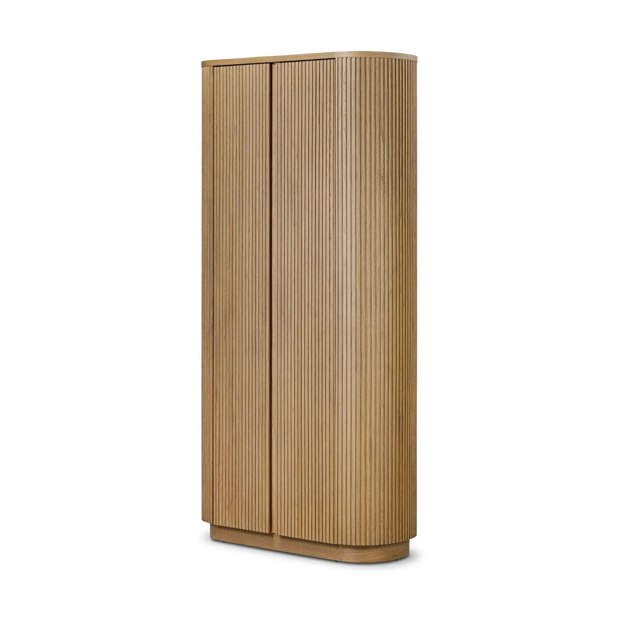 Crafted from light oak with a plinth-style base, rounded sides and linear reeding, this tall cabinet works subtle midcentury vibes into any space. Fully finished interior and shelves for quality detailing inside and out Amethyst Home provides interior design, new home construction design consulting, vintage area rugs, and lighting in the Salt Lake City metro area.
