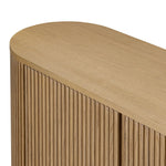 Crafted from desert oak solids and veneers with a plinth-style base, rounded sides and linear reeding, this sideboard exudes midcentury vibes.  Fully finished interior and shelves for quality detailing inside and out Amethyst Home provides interior design, new home construction design consulting, vintage area rugs, and lighting in the Park City metro area.