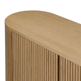 Crafted from desert oak solids and veneers with a plinth-style base, rounded sides and linear reeding, this sideboard exudes midcentury vibes.  Fully finished interior and shelves for quality detailing inside and out Amethyst Home provides interior design, new home construction design consulting, vintage area rugs, and lighting in the Park City metro area.