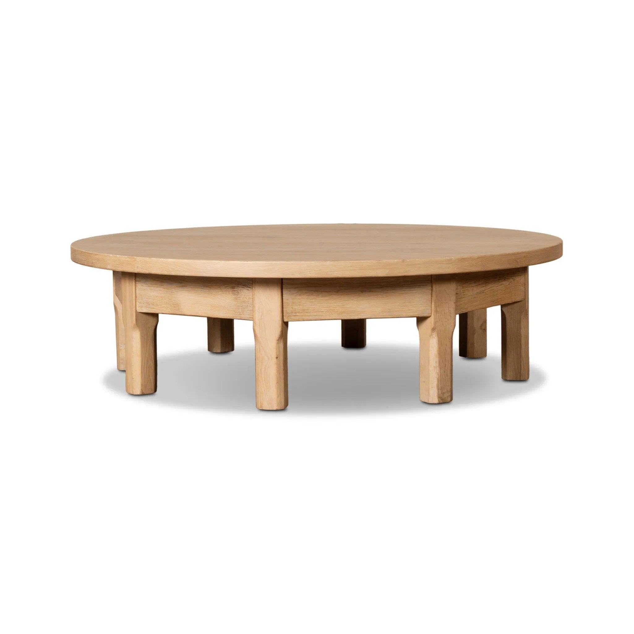 Made from bleached oak, a unique eight-leg base supports a rounded tabletop. Inspired by a "found object" aesthetic, this piece works a nomadic vibe into any room Amethyst Home provides interior design, new home construction design consulting, vintage area rugs, and lighting in the Monterey metro area.
