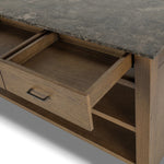A kitchen island and waterfall dining table in one. Crafted from oak, the island system features two large shelves and three drawers on each side, all  topped with by warm grey marble. The pullout table extends and fits inside the frame with ease Amethyst Home provides interior design, new home construction design consulting, vintage area rugs, and lighting in the Park City metro area.