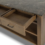 A kitchen island and waterfall dining table in one. Crafted from oak, the island system features two large shelves and three drawers on each side, all  topped with by warm grey marble. The pullout table extends and fits inside the frame with ease Amethyst Home provides interior design, new home construction design consulting, vintage area rugs, and lighting in the Park City metro area.