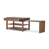 A kitchen island and waterfall dining table in one. Crafted from oak, the island system features two large shelves and three drawers on each side, all  topped with by warm grey marble. The pullout table extends and fits inside the frame with ease Amethyst Home provides interior design, new home construction design consulting, vintage area rugs, and lighting in the Winter Garden metro area.