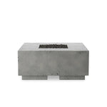 This outdoor fire table is a welcoming centerpiece designed for gathering. Made from glass-reinforced concrete, each piece is naturally finished with deep tones of pewter and dark grey. The monolithic shape is completed with lavastones in the center, bringing together a bold, monochromatic look. Amethyst Home provides interior design, new home construction design consulting, vintage area rugs, and lighting in the Alpharetta metro area.