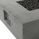 This outdoor fire table is a welcoming centerpiece designed for gathering. Made from glass-reinforced concrete, each piece is naturally finished with deep tones of pewter and dark grey. The monolithic shape is completed with lavastones in the center, bringing together a bold, monochromatic look. Amethyst Home provides interior design, new home construction design consulting, vintage area rugs, and lighting in the Calabasas metro area.
