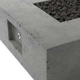 This outdoor fire table is a welcoming centerpiece designed for gathering. Made from glass-reinforced concrete, each piece is naturally finished with deep tones of pewter and dark grey. The monolithic shape is completed with lavastones in the center, bringing together a bold, monochromatic look. Amethyst Home provides interior design, new home construction design consulting, vintage area rugs, and lighting in the Calabasas metro area.