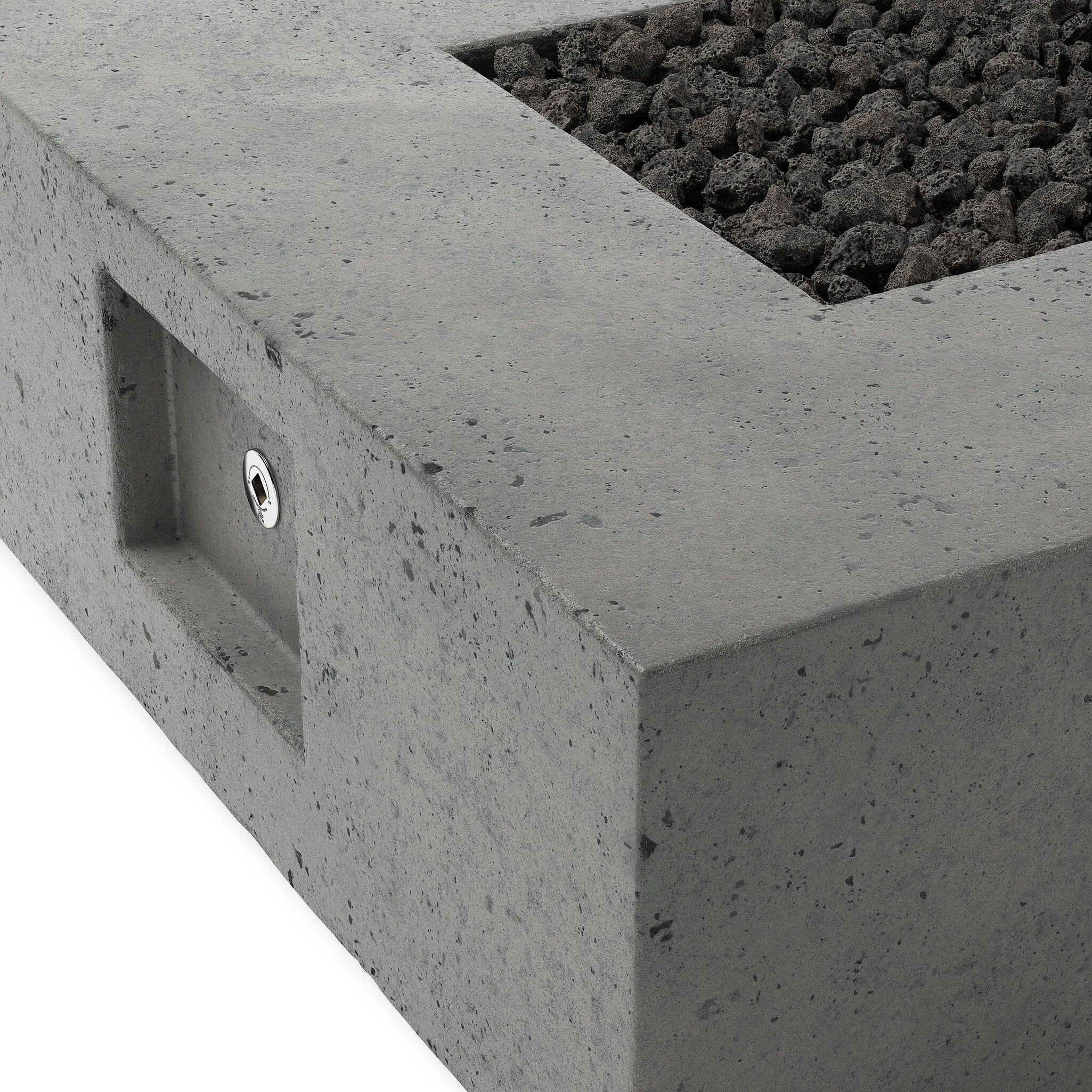 This outdoor fire table is a welcoming centerpiece designed for gathering. Made from glass-reinforced concrete, each piece is naturally finished with deep tones of pewter and dark grey. The monolithic shape is completed with lavastones in the center, bringing together a bold, monochromatic look. Amethyst Home provides interior design, new home construction design consulting, vintage area rugs, and lighting in the Calabasas metro area.