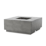 This outdoor fire table is a welcoming centerpiece designed for gathering. Made from glass-reinforced concrete, each piece is naturally finished with deep tones of pewter and dark grey. The monolithic shape is completed with lavastones in the center, bringing together a bold, monochromatic look. Amethyst Home provides interior design, new home construction design consulting, vintage area rugs, and lighting in the Newport Beach metro area.
