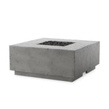 This outdoor fire table is a welcoming centerpiece designed for gathering. Made from glass-reinforced concrete, each piece is naturally finished with deep tones of pewter and dark grey. The monolithic shape is completed with lavastones in the center, bringing together a bold, monochromatic look. Amethyst Home provides interior design, new home construction design consulting, vintage area rugs, and lighting in the Newport Beach metro area.
