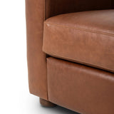 The popular Art Deco club chair makes a comeback. With a prominent curved top, deep seat with a loose cushion, and armrests designed for true relaxation, the armchair invites you to sit back and take it all in. Upholstered in rich mahogany top-grain leather. Amethyst Home provides interior design, new home construction design consulting, vintage area rugs, and lighting in the Charlotte metro area.