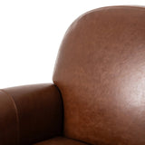 The popular Art Deco club chair makes a comeback. With a prominent curved top, deep seat with a loose cushion, and armrests designed for true relaxation, the armchair invites you to sit back and take it all in. Upholstered in rich mahogany top-grain leather. Amethyst Home provides interior design, new home construction design consulting, vintage area rugs, and lighting in the Omaha metro area.