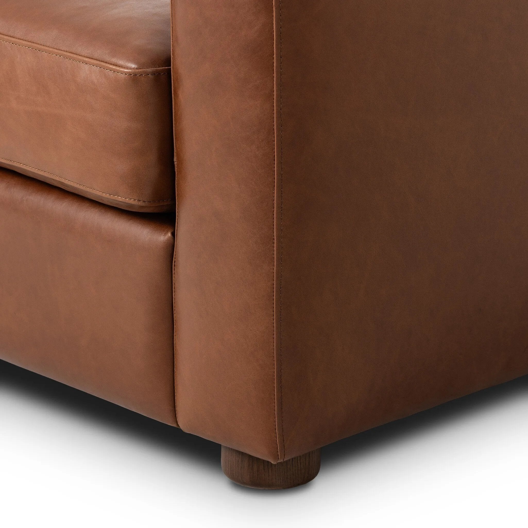 The popular Art Deco club chair makes a comeback. With a prominent curved top, deep seat with a loose cushion, and armrests designed for true relaxation, the armchair invites you to sit back and take it all in. Upholstered in rich mahogany top-grain leather. Amethyst Home provides interior design, new home construction design consulting, vintage area rugs, and lighting in the Scottsdale metro area.