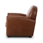 The popular Art Deco club chair makes a comeback. With a prominent curved top, deep seat with a loose cushion, and armrests designed for true relaxation, the armchair invites you to sit back and take it all in. Upholstered in rich mahogany top-grain leather. Amethyst Home provides interior design, new home construction design consulting, vintage area rugs, and lighting in the Tampa metro area.