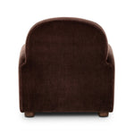The popular Art Deco club chair makes a comeback. With a prominent curved top, deep seat with a loose cushion, and armrests designed for true relaxation, the armchair invites you to sit back and take it all in. Upholstered in rich chocolate upholstery.As fans of luxe materials at Amethyst, we love the nature inspired Draper Chair - Monte Chocolate. Amethyst Home provides interior design, new home construction design consulting, vintage area rugs, and lighting in the Dallas metro area.