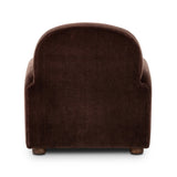 The popular Art Deco club chair makes a comeback. With a prominent curved top, deep seat with a loose cushion, and armrests designed for true relaxation, the armchair invites you to sit back and take it all in. Upholstered in rich chocolate upholstery.As fans of luxe materials at Amethyst, we love the nature inspired Draper Chair - Monte Chocolate. Amethyst Home provides interior design, new home construction design consulting, vintage area rugs, and lighting in the Dallas metro area.