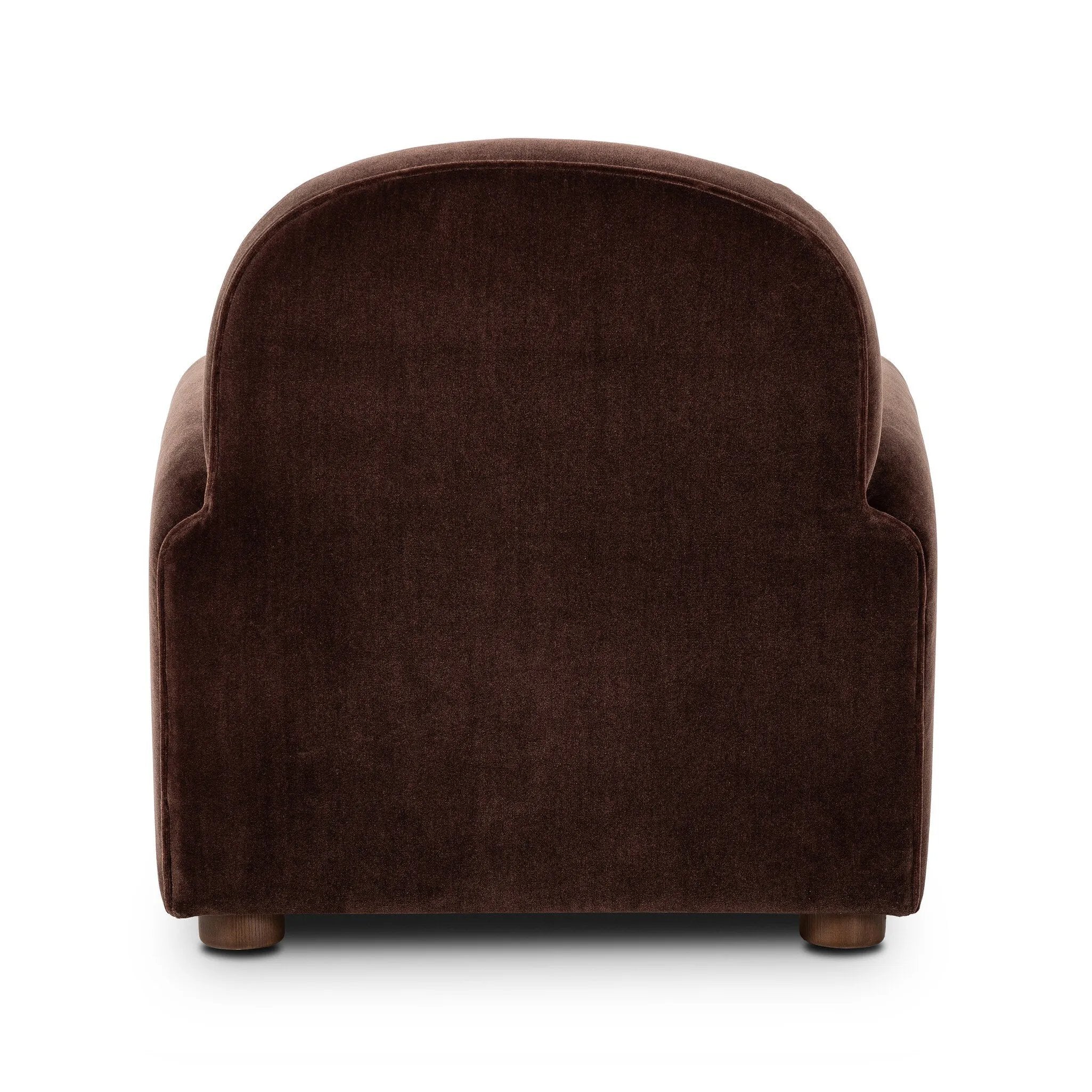 The popular Art Deco club chair makes a comeback. With a prominent curved top, deep seat with a loose cushion, and armrests designed for true relaxation, the armchair invites you to sit back and take it all in. Upholstered in rich chocolate upholstery.As fans of luxe materials at Amethyst, we love the nature inspired Draper Chair - Monte Chocolate. Amethyst Home provides interior design, new home construction design consulting, vintage area rugs, and lighting in the Dallas metro area.