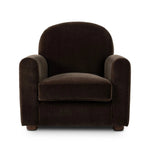 The popular Art Deco club chair makes a comeback. With a prominent curved top, deep seat with a loose cushion, and armrests designed for true relaxation, the armchair invites you to sit back and take it all in. Upholstered in rich chocolate upholstery.As fans of luxe materials at Amethyst, we love the nature inspired Draper Chair - Monte Chocolate. Amethyst Home provides interior design, new home construction design consulting, vintage area rugs, and lighting in the Laguna Beach metro area.