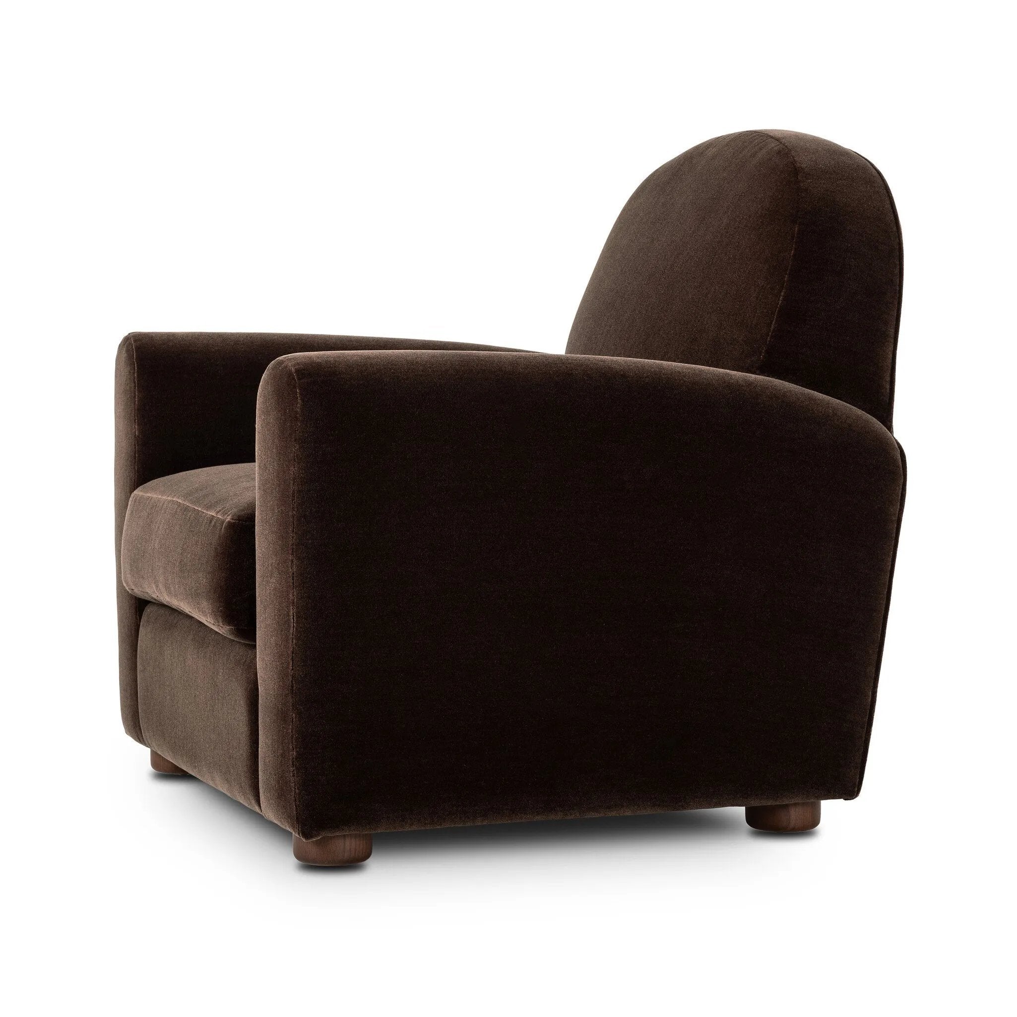 The popular Art Deco club chair makes a comeback. With a prominent curved top, deep seat with a loose cushion, and armrests designed for true relaxation, the armchair invites you to sit back and take it all in. Upholstered in rich chocolate upholstery.As fans of luxe materials at Amethyst, we love the nature inspired Draper Chair - Monte Chocolate. Amethyst Home provides interior design, new home construction design consulting, vintage area rugs, and lighting in the Los Angeles metro area.