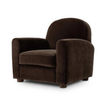 The popular Art Deco club chair makes a comeback. With a prominent curved top, deep seat with a loose cushion, and armrests designed for true relaxation, the armchair invites you to sit back and take it all in. Upholstered in rich chocolate upholstery.As fans of luxe materials at Amethyst, we love the nature inspired Draper Chair - Monte Chocolate. Amethyst Home provides interior design, new home construction design consulting, vintage area rugs, and lighting in the Portland metro area.