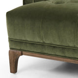 A low, spacious mid-century silhouette is covered in velvety upholstery in an intriguing sapphire olive, with blind tufting Amethyst Home provides interior design, new home construction design consulting, vintage area rugs, and lighting in the Alpharetta metro area.