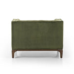 A low, spacious mid-century silhouette is covered in velvety upholstery in an intriguing sapphire olive, with blind tufting Amethyst Home provides interior design, new home construction design consulting, vintage area rugs, and lighting in the Calabasas metro area.