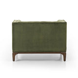 A low, spacious mid-century silhouette is covered in velvety upholstery in an intriguing sapphire olive, with blind tufting Amethyst Home provides interior design, new home construction design consulting, vintage area rugs, and lighting in the Calabasas metro area.