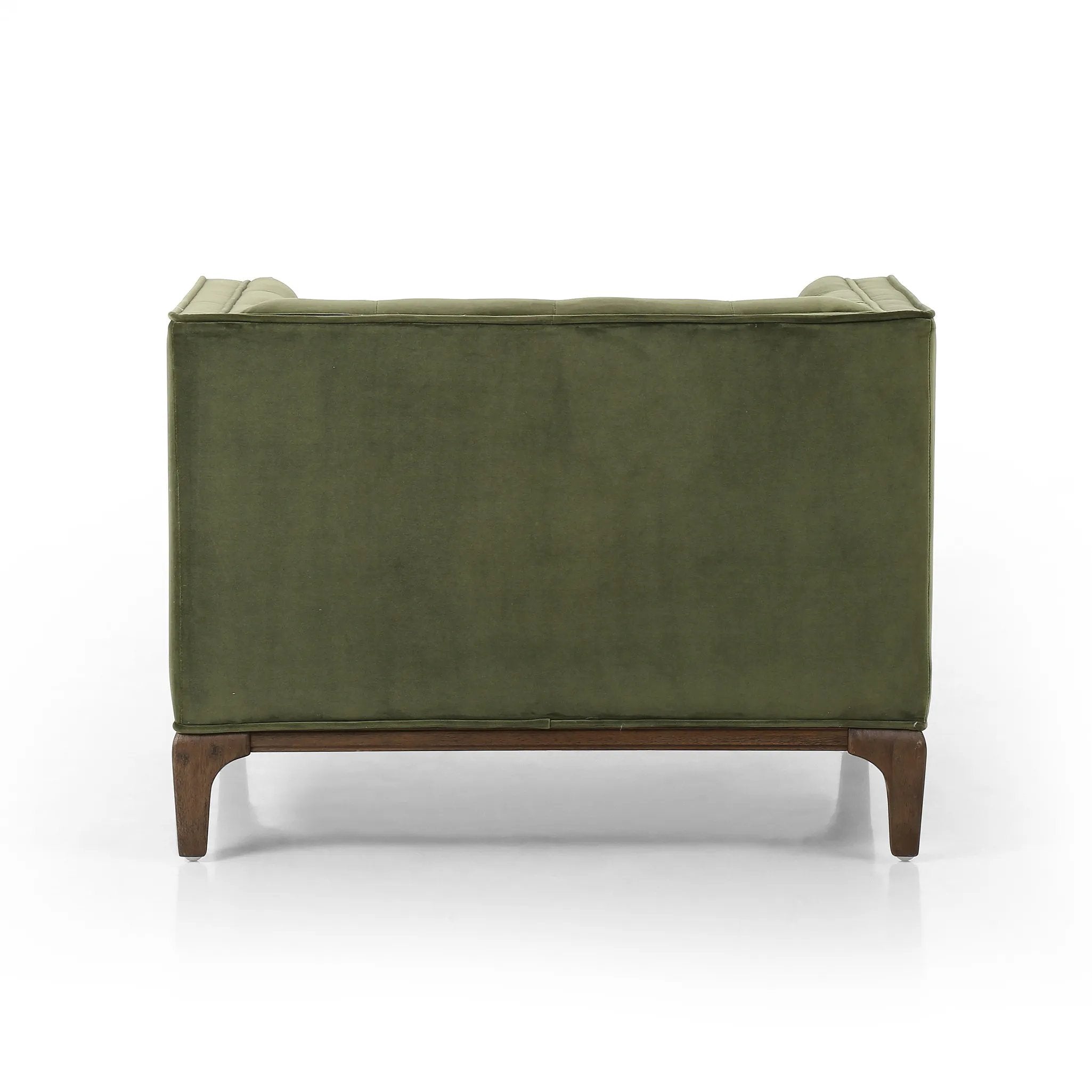 A low, spacious mid-century silhouette is covered in velvety upholstery in an intriguing sapphire olive, with blind tufting Amethyst Home provides interior design, new home construction design consulting, vintage area rugs, and lighting in the Calabasas metro area.