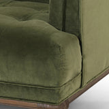 A low, spacious mid-century silhouette is covered in velvety upholstery in an intriguing sapphire olive, with blind tufting Amethyst Home provides interior design, new home construction design consulting, vintage area rugs, and lighting in the Laguna Beach metro area.