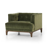 A low, spacious mid-century silhouette is covered in velvety upholstery in an intriguing sapphire olive, with blind tufting Amethyst Home provides interior design, new home construction design consulting, vintage area rugs, and lighting in the Monterey metro area.
