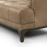 A modernized midcentury silhouette meets the traditional Chesterfield sofa, all in a compact profile perfect for smaller spaces. Top-grain leather in a tan hue, button tufting and a smooth touch bring deep comfort to lounging Amethyst Home provides interior design, new home construction design consulting, vintage area rugs, and lighting in the Laguna Beach metro area.