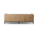 A modernized midcentury silhouette meets the traditional Chesterfield sofa, all in a compact profile perfect for smaller spaces. Top-grain leather in a tan hue, button tufting and a smooth touch bring deep comfort to lounging Amethyst Home provides interior design, new home construction design consulting, vintage area rugs, and lighting in the Park City metro area.