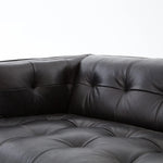 A modernized midcentury silhouette meets the traditional Chesterfield sofa, all in a compact profile perfect for smaller spaces. Top-grain leather in a classic black, button tufting and a smooth touch bring deep comfort to lounging Amethyst Home provides interior design, new home construction design consulting, vintage area rugs, and lighting in the Winter Garden metro area.