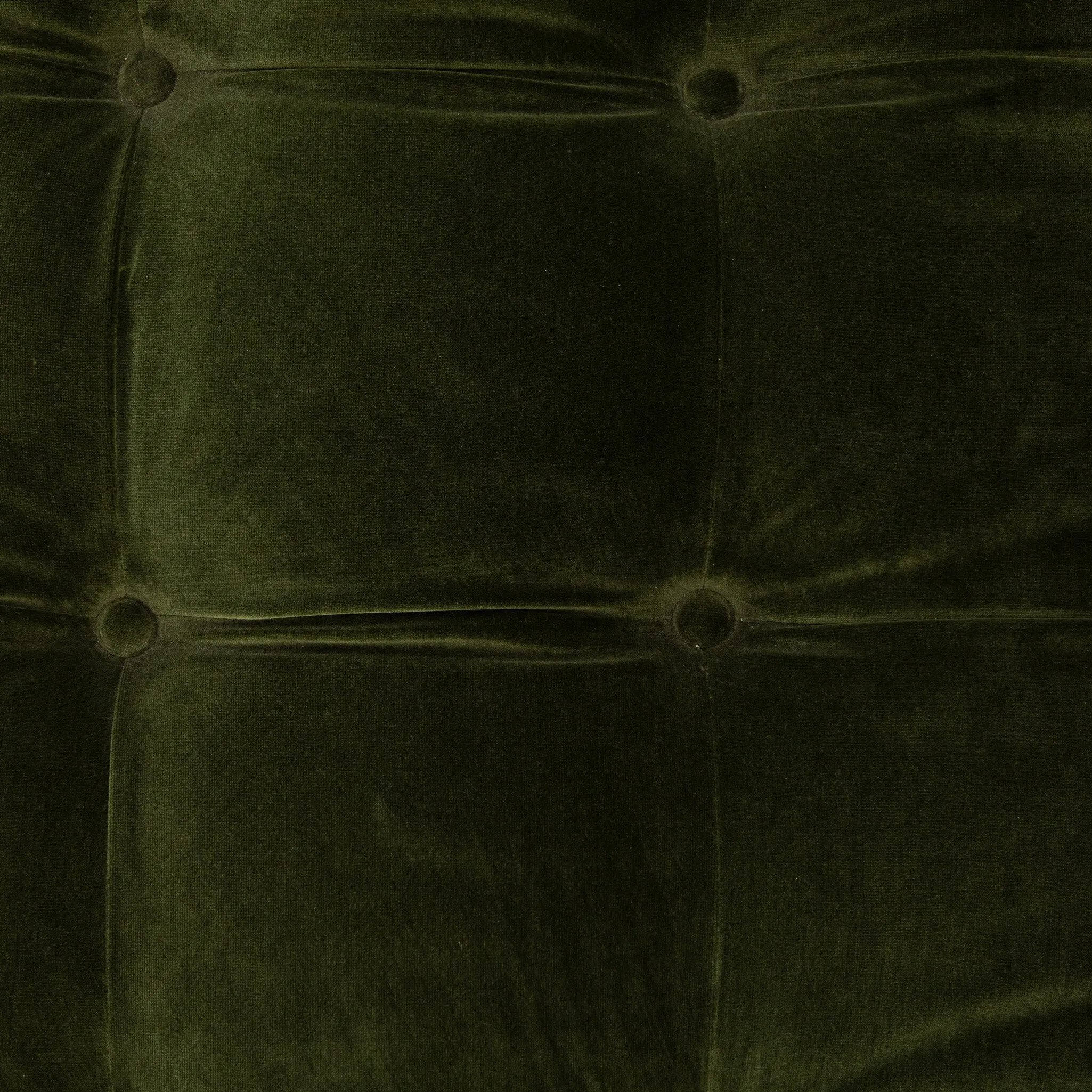 A modernized midcentury silhouette meets the traditional Chesterfield sofa, all in a compact profile perfect for smaller spaces. Smooth velvet in an olive hue, button tufting and a soft touch bring deep comfort to lounging Amethyst Home provides interior design, new home construction design consulting, vintage area rugs, and lighting in the Austin metro area.