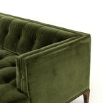A modernized midcentury silhouette meets the traditional Chesterfield sofa, all in a compact profile perfect for smaller spaces. Smooth velvet in an olive hue, button tufting and a soft touch bring deep comfort to lounging Amethyst Home provides interior design, new home construction design consulting, vintage area rugs, and lighting in the Des Moines metro area.