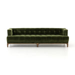 A modernized midcentury silhouette meets the traditional Chesterfield sofa, all in a compact profile perfect for smaller spaces. Smooth velvet in an olive hue, button tufting and a soft touch bring deep comfort to lounging Amethyst Home provides interior design, new home construction design consulting, vintage area rugs, and lighting in the Park City metro area.