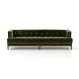 A modernized midcentury silhouette meets the traditional Chesterfield sofa, all in a compact profile perfect for smaller spaces. Smooth velvet in an olive hue, button tufting and a soft touch bring deep comfort to lounging Amethyst Home provides interior design, new home construction design consulting, vintage area rugs, and lighting in the Park City metro area.