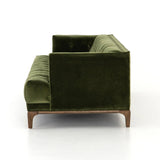 A modernized midcentury silhouette meets the traditional Chesterfield sofa, all in a compact profile perfect for smaller spaces. Smooth velvet in an olive hue, button tufting and a soft touch bring deep comfort to lounging Amethyst Home provides interior design, new home construction design consulting, vintage area rugs, and lighting in the Portland metro area.