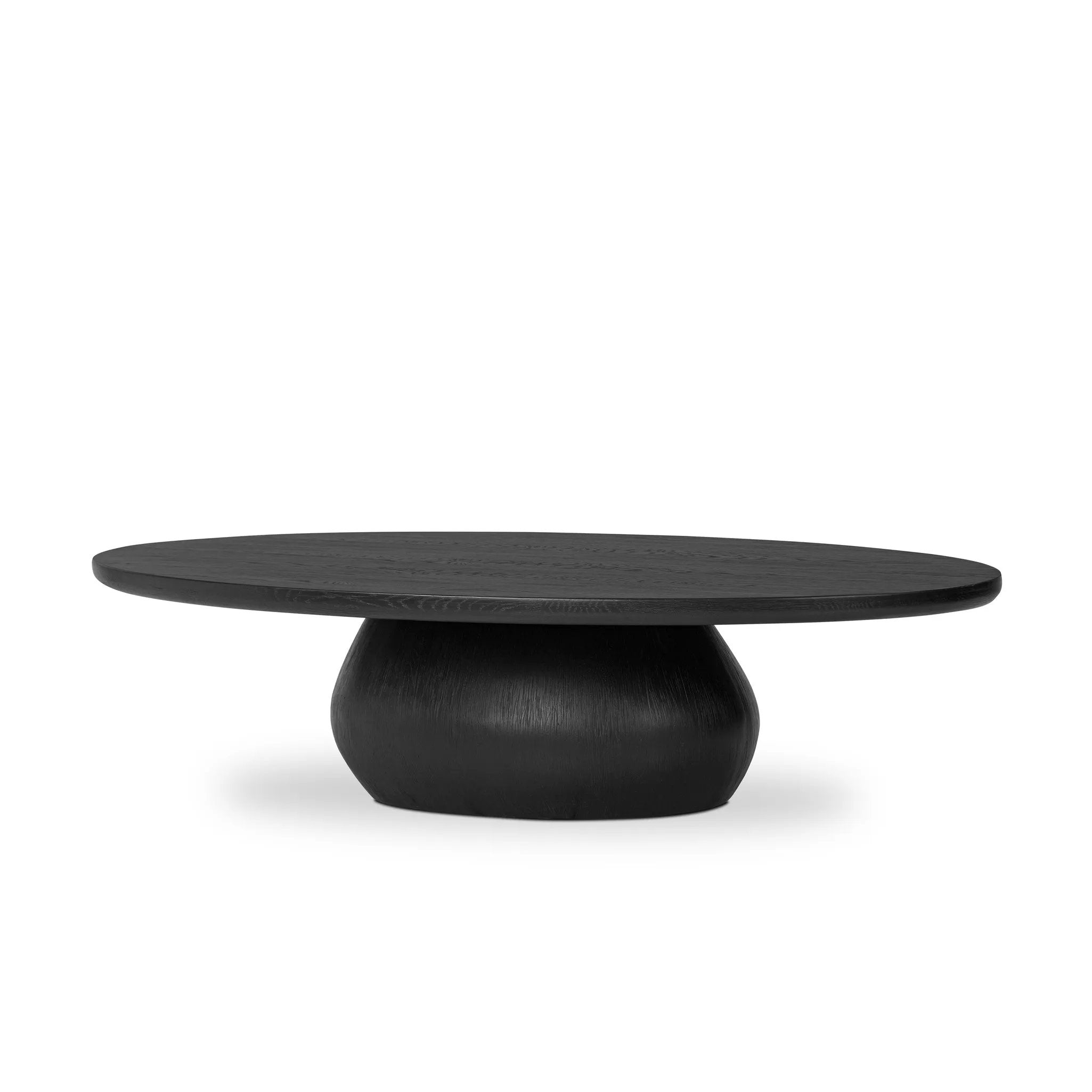 Anchor your space in shape with a beautifully contoured coffee table of worn black resin designed to mimic oak. Rounded oval top features reverse bullnose edging for a design-forward touch Amethyst Home provides interior design, new home construction design consulting, vintage area rugs, and lighting in the Laguna Beach metro area.
